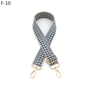 Adjustable checkered bag strap with blue and beige patterns and gold metal lobster clips