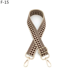 Adjustable checkerboard woven strap with gold swivel hooks and checkered brown pattern