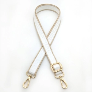 Adjustable geometric pattern bag strap in beige with gold metal hooks and hardware