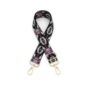 Adjustable woven jacquard bag strap with purple geometric patterns and gold metal hooks
