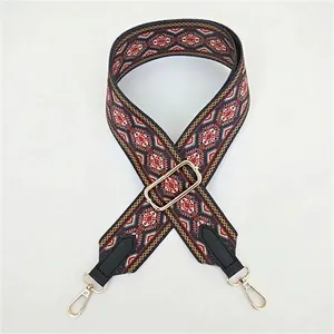 Adjustable wide embroidered shoulder strap with ethnic geometric patterns and gold clips