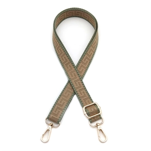 Adjustable 2.5cm wide woven bag strap with green meander pattern and gold buckles