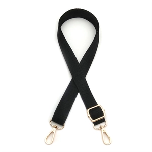 Detail view of 2.5cm black adjustable strap with gold metal rotating hooks and flat weave