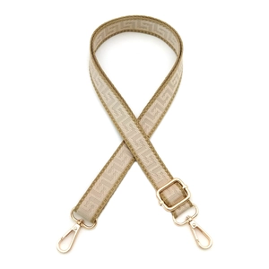 Close-up of adjustable 2.5cm beige woven bag strap with geometric patterns and gold clips