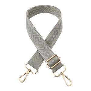 Detail view of gray diamond pattern woven strap with gold metal lobster clasps