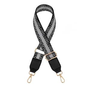 Adjustable leopard spot bag strap with metal hooks and black leather ends on white background