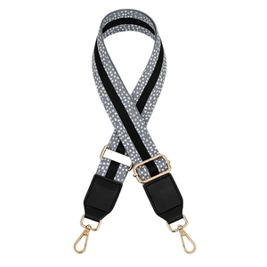 Close-up of adjustable leopard print bag strap with gold metal hooks and leather trim