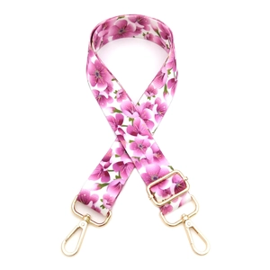 Adjustable crossbody bag strap with pink cherry blossom pattern and gold metal hardware