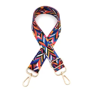 Ethnic bohemian woven bag strap with colorful geometric patterns and gold metal buckles