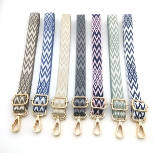 Seven patterned 2.5cm woven bag straps with gold metal clasps for cross-body bags