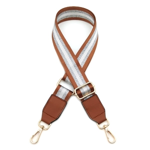 Adjustable brown canvas strap with silver stripes and golden metal hooks for handbags