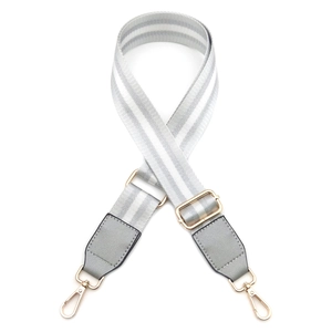 Detail of adjustable grey striped canvas strap with gold swivel lobster clasps