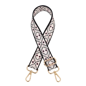 Ethnic geometric pattern woven crossbody strap with adjustable gold buckles on white back