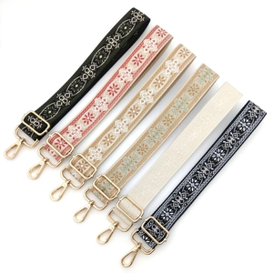 Adjustable ethnic style woven bag straps with colorful patterns and gold metal buckles