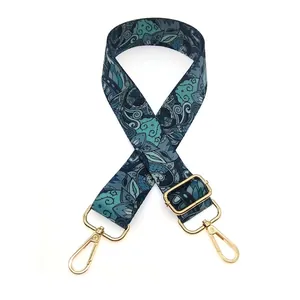 Close-up of No. 4 retro green floral wide bag strap with gold metal swivel hooks