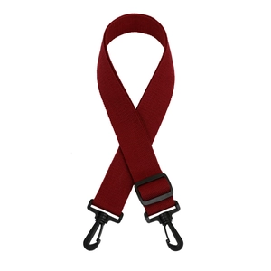 Detail view of wine red woven nylon shoulder strap with black swivel hooks and adjuster