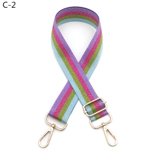 Adjustable bag strap with purple and green glitter stripes and gold metal lobster clasps