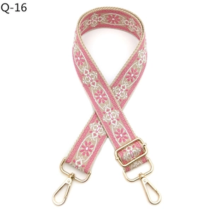 Detail of pink floral woven bag strap with light gold metal swivel lobster clasps