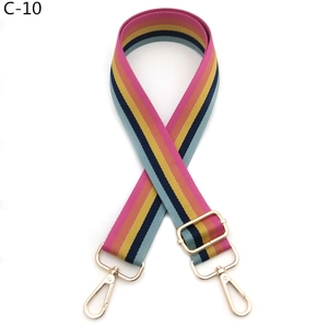 Detailed view of adjustable colorful striped bag strap with gold-tone metal swivel hooks