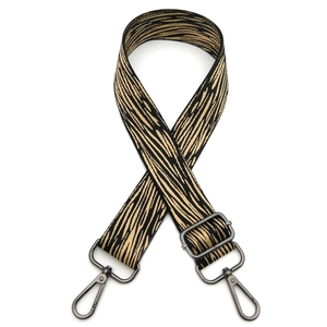 Detail of adjustable wide shoulder strap with black and yellow pattern and gunmetal hooks