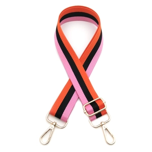 Adjustable striped woven purse strap in pink, orange, and black with gold metal hooks