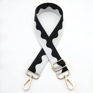 Adjustable black and white wave pattern canvas shoulder strap with gold metal buckles
