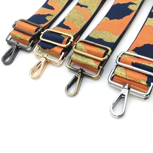 Detail of camouflage bag straps with gold thread and four metal hardware finish options