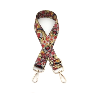 Adjustable crossbody bag strap with ethnic mandala pattern and gold metal buckles