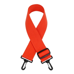 Close-up of orange woven strap with black plastic buckles and adjustable length