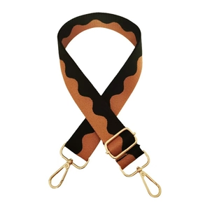 Close-up of wavy orange and black shoulder strap with polished gold-tone metal clips