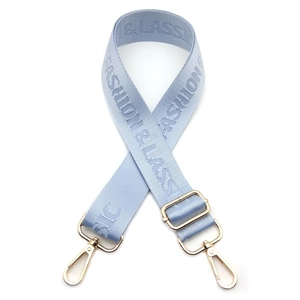 Detail of adjustable nylon bag strap with Fashion & Classic jacquard and gold metal hooks