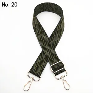Close-up of adjustable woven shoulder strap in dark green and black chevron pattern