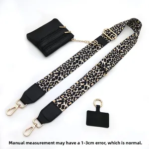 Adjustable leopard print strap with black zipper coin purse and gold metal hardware