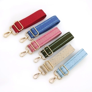 Detail of adjustable woven bag straps with chevron texture in six vibrant colors