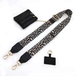 Adjustable leopard print wide strap with black mini pouch and gold hardware accents
