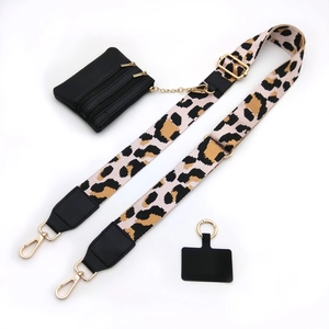 Adjustable leopard print strap with gold buckles and a small black triple-zipper wallet pouch