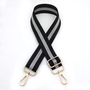 Adjustable black and silver stripe woven bag strap with elegant light gold metal hardware