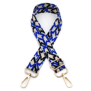 Adjustable wide woven shoulder strap with geometric star pattern and gold metal hooks