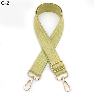 Detail of adjustable woven chevron strap with premium golden metal lobster clasps