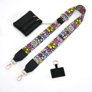 Adjustable floral pattern strap with black coin purse and gold chain detail