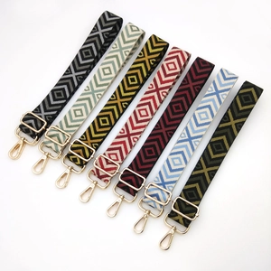 Adjustable woven canvas guitar style bag straps with colorful geometric patterns and gold clips