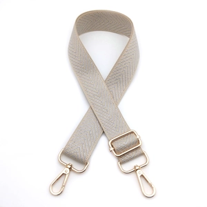 Adjustable beige and silver woven herringbone bag strap with gold metal lobster clasps