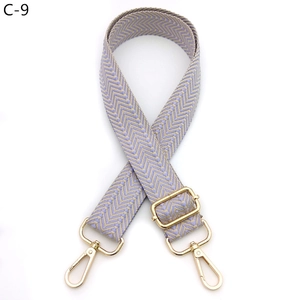 Close-up of lilac and gold chevron woven adjustable shoulder strap with metal hooks