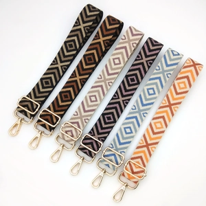 Adjustable woven canvas shoulder straps with geometric diamond patterns and gold hooks