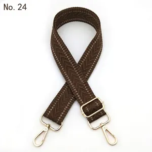 Adjustable brown herringbone woven bag strap with light gold metal swivel hooks