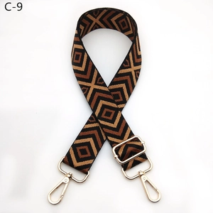 Close-up of geometric diamond pattern strap with golden metal lobster clasps