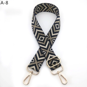 Detail of woven diamond leopard pattern strap with adjustable golden metal swivel hooks