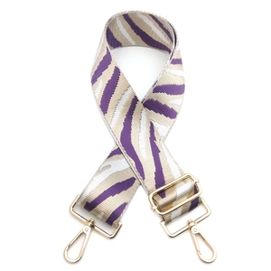 Adjustable zebra print purse strap in purple and beige with gold metal lobster clasps