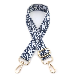 Close-up of adjustable navy diamond pattern woven shoulder strap with gold swivel hooks