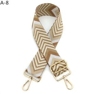 Detail of adjustable bohemian chevron bag strap with gold metal lobster clasps